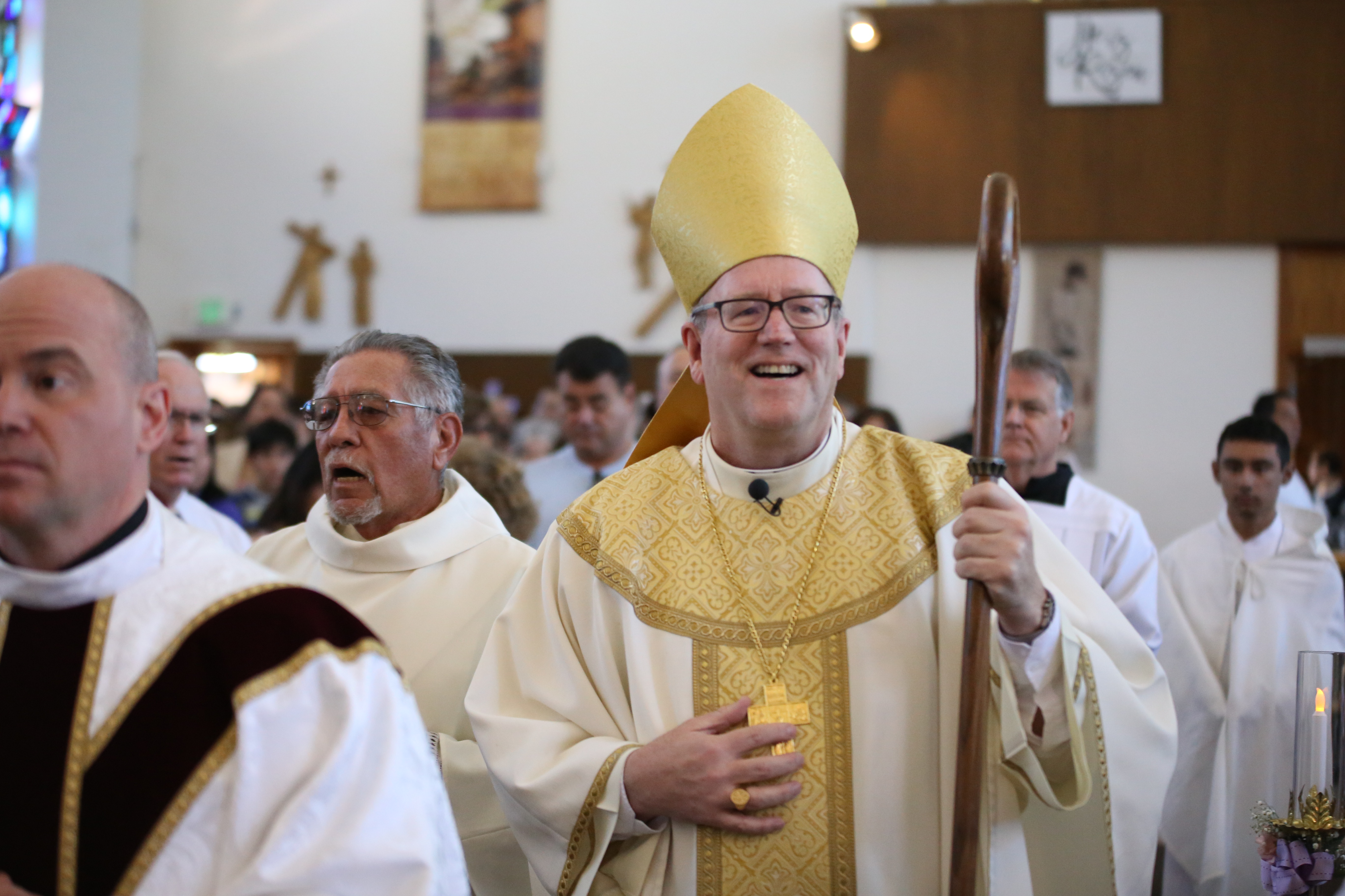 Bishop Barron smiling in a Mass procession