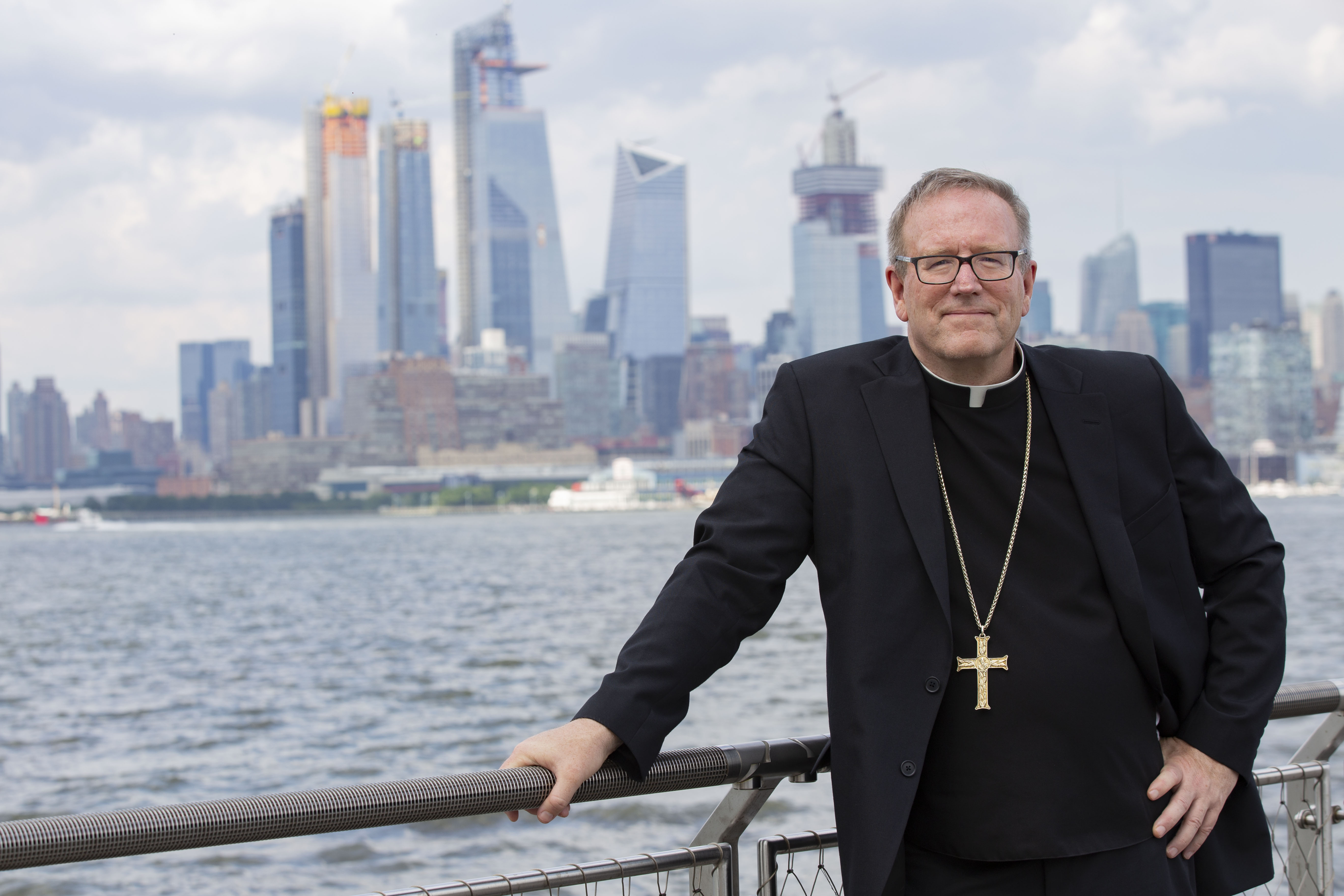 Bishop Barron with a cityscape